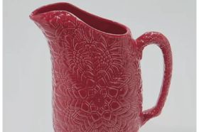 Inspired by original pieces made by students at Camphill Special School, this etched pitcher is made for lazy summer days sipping iced tea or lemonade. Inspired by original pieces made by students at Camphill Special School. Product is not manufactured at the school. Inspired by original pieces made by students at Camphill Special School Etched design Ceramic construction Microwave-safe; hand wash only Measures 7"L x 4.52"W x 9.05"H Imported